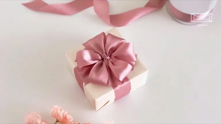 Beautiful gift-wrapping with satin ribbon.