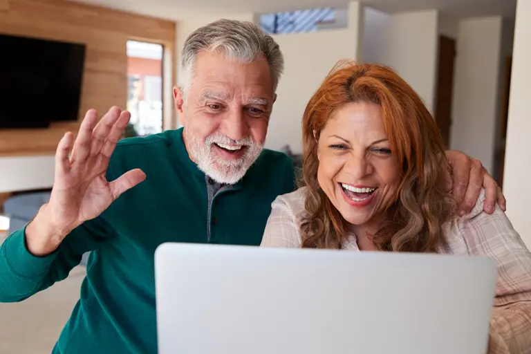 Senior Hispanic couple on a video chat.